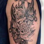 Tattoo mit Oni Maske als Motiv